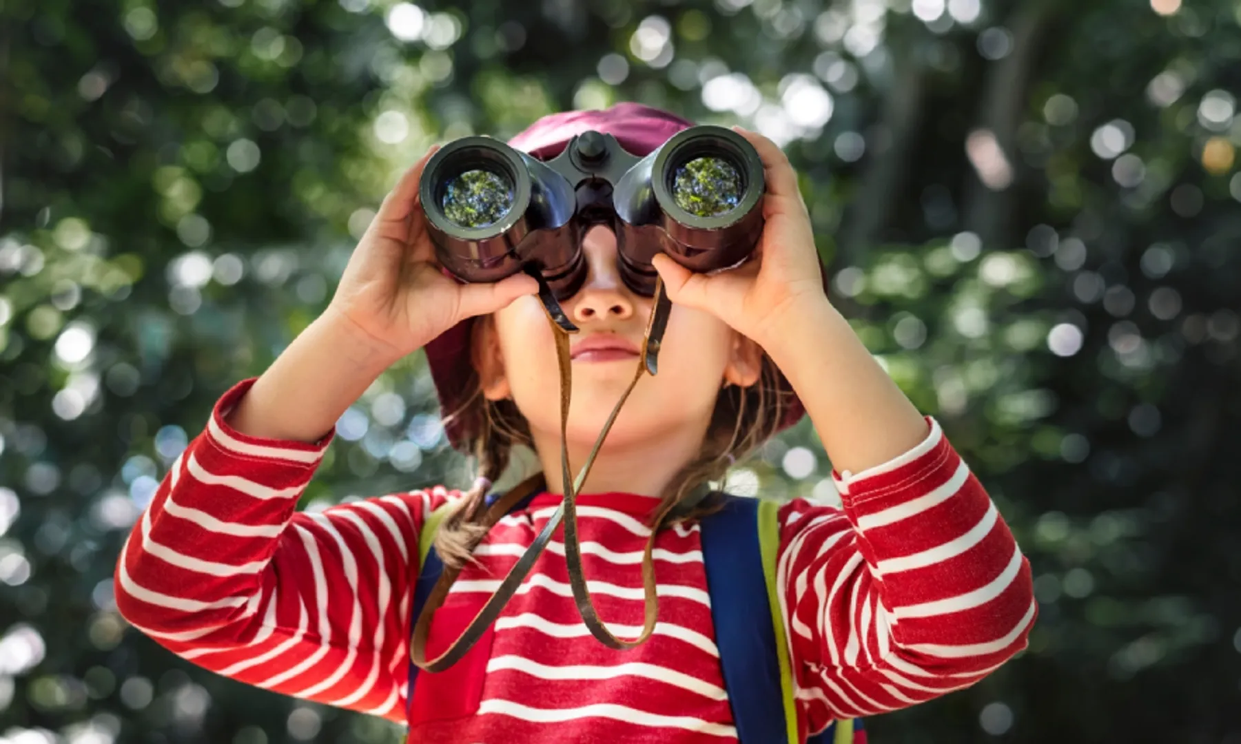 Photo of young girl with binoculars