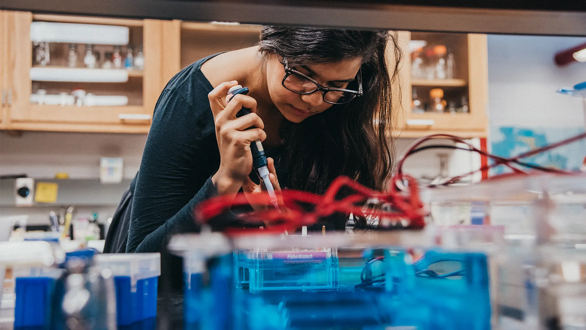 Innovation hub banner photo of young woman in lab