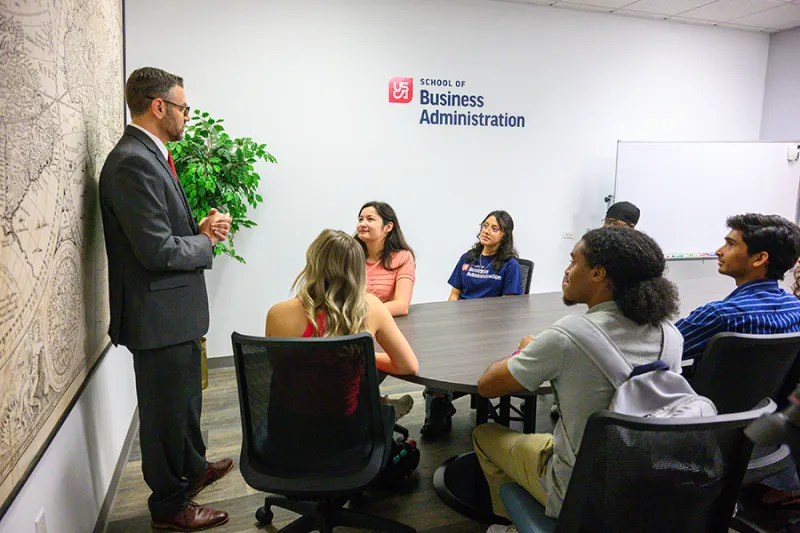 Dr. John Engel, left, is a faculty member in the USCA School of Business Administration, which once again earned a distinction held by just 6 percent of business schools worldwide. The Association to Advance Collegiate Schools of Business, the premier business school accrediting body, renewed accreditation for SOBA's graduate and undergraduate business programs.