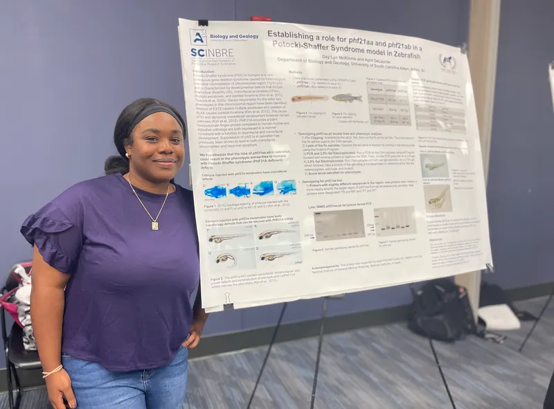 Day’Lyn McKinnis, a junior biology major at USCA, presents her project during the SSI event.
