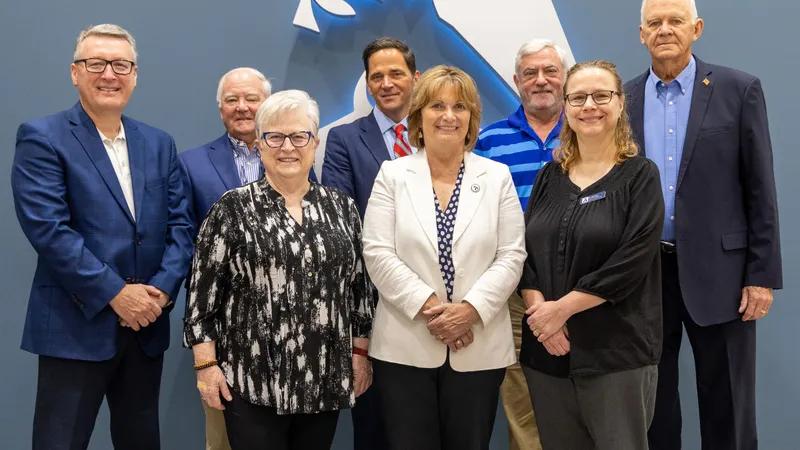 Front Row: Sally Jennings, Mary Driscoll, and Dr. Lisa Ennis; Back Row: R. Keith Wood, Ira “Bud” Coward, Chancellor Heimmermann, Tim Wertz, and George Mitchell