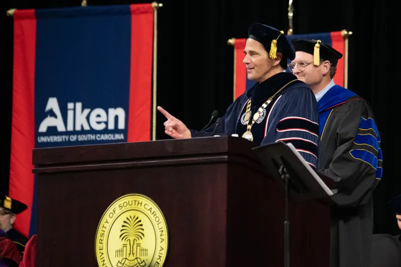 USCA Chancellor Daniel J. Heimmermann addressed the graduates with a message of optimism, emphasizing their potential to impact the world.