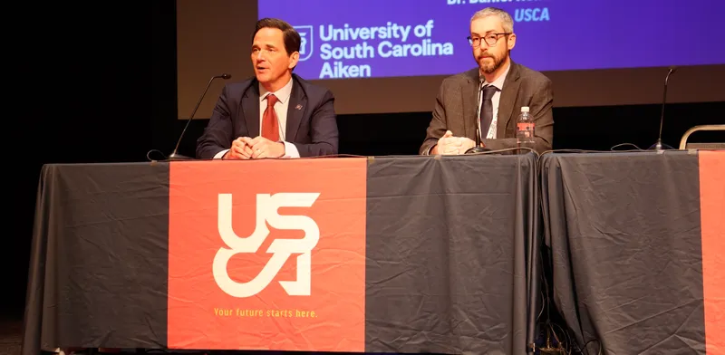 USCA Chancellor Dr. Daniel Heimmermann (left) and Matt Griffin, head of nuclear affairs (right), sign the Antares partnership agreement.
