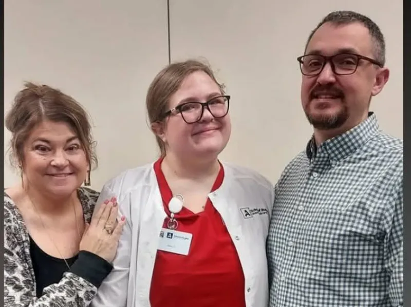 Alexa Carnahan (center) is pictured with her parents. Her passion for nursing was inspired by her late grandmother, a licensed practical nurse. (Courtesy photo)
