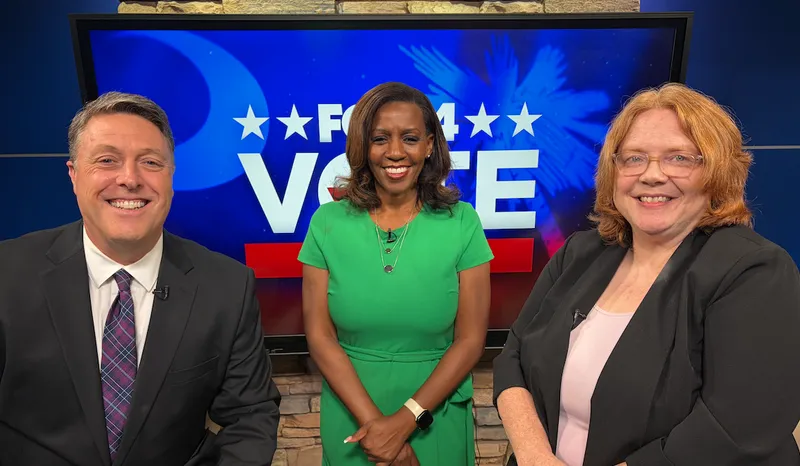 From left to right: Trent Butler (evening anchor), Kimberely Scott (evening anchor), Dr. Sarah Young (USCA associate professor)
