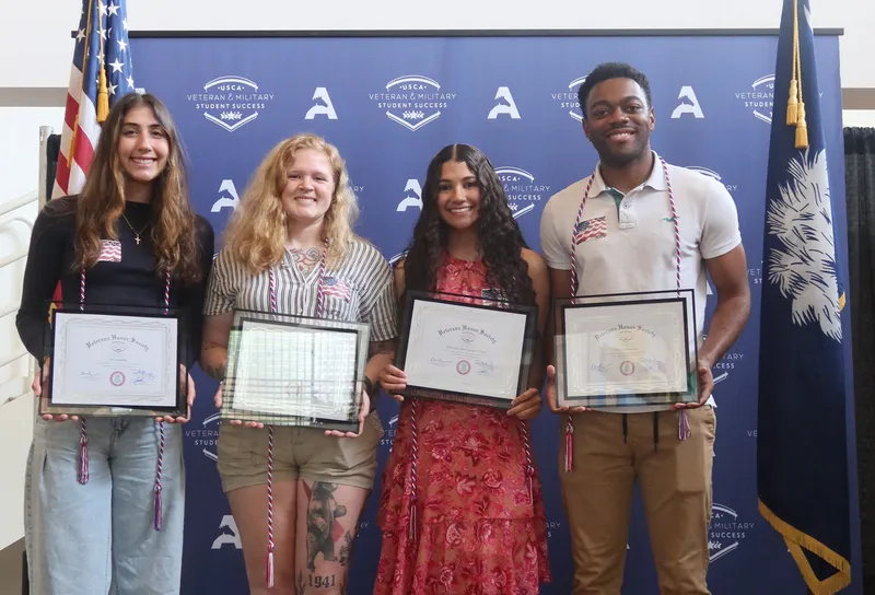From left, Ali Samaha, Elenora Gazzelli, Sairielys Hernandez-Cruz, Irvon Malcom were among the students inducted into USCA’s Veterans Honor Society Pi Alpha Sigma. These four will be commissioned as U.S. Army second lieutenants during commencement May 6. USCA photo by Aurora Cervantez.