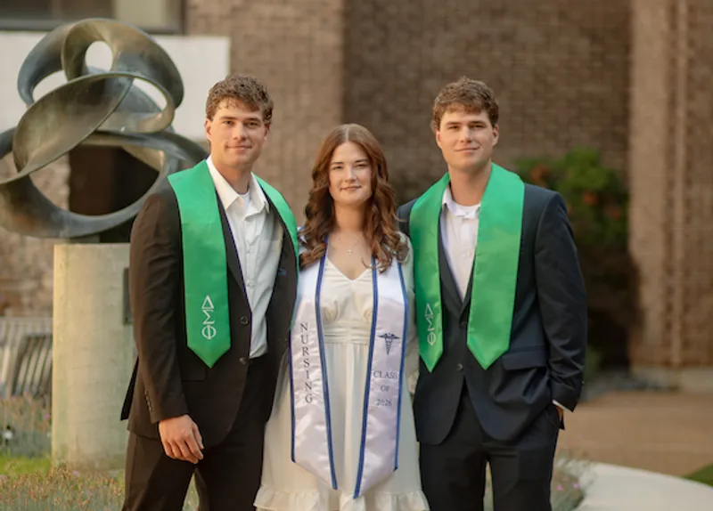 From left to right: Alex, Sydney and Zane Yougue will cross the stage together, each earning a degree from USCA.